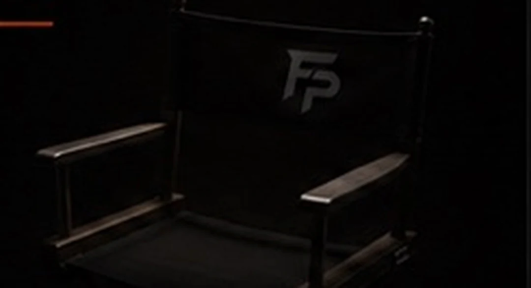 Dark production studio room with brand mark